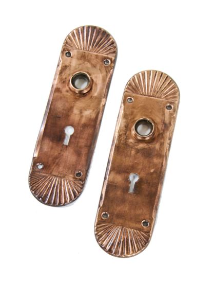 matching set of original late 19th century american antique ornamental wrought bronze rounded edge residential passage door escutcheons