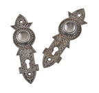 original 19th century matching ornamental cast iron "screwless spindle" interior residential doorknob backplates or escutcheons