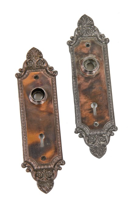 original early 20th century american antique "geneva" pattern interior residential ornamental cast iron doorknob backplates with oxidized copper-plated finish