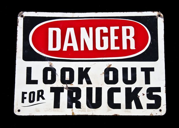 original late 1940's american vintage industrial single-sided "look out for trucks" paint factory loading dock cautionary sign