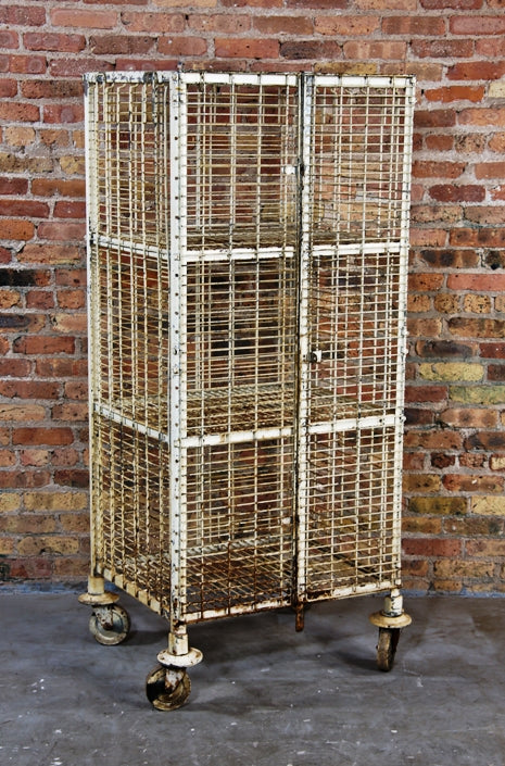 unique oversized vintage american industrial reinforced heavy gauge steel wire multi-tier mobile security cage or truck with intact double swing-out doors