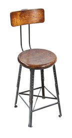 fully adjustable c. 1920's american industrial four-legged angled steel factory work stool with original dark green baked enameled finish