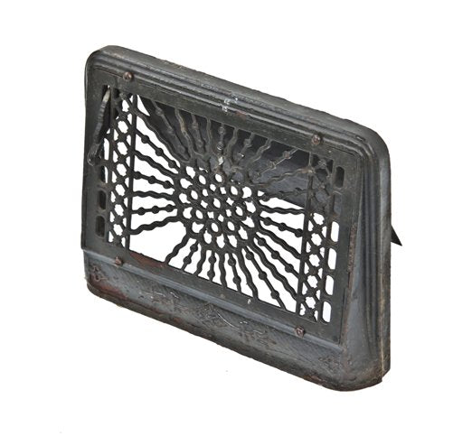 original "flamboyant" pattern interior residential ornamental black enameled cast iron baseboard register with striking sunburst motif