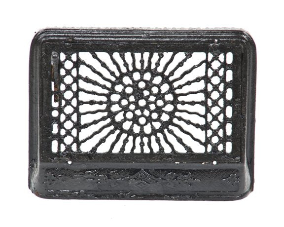 original and fully functional early 20th century antique american black enameled ornamental cast iron "flamboyant" pattern baseboard register with single louver