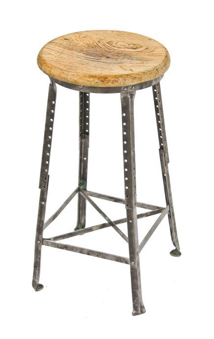 fully adjustable early 1920's american vintage industrial four-legged factory workbench stool with pre-drilled hole extensions