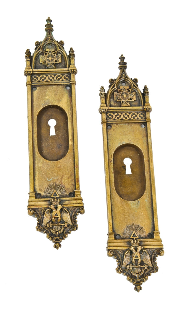 set of extraordinary early 20th century ornamental cast bronze masonic oversized pocket door handles featuring a double-headed eagle and eight-pointed star