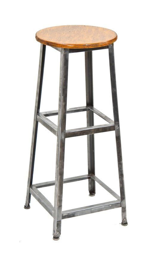 unusual c. 1940's american made vintage industrial four-legged brushed angled steel factory stool with intact steel disc shoes or feet