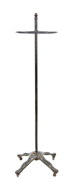 turn of the century american vintage industrial black enameled metal freestanding garment rack with ornamental cast iron base with casters