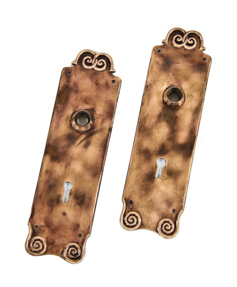 matching set of original late 19th or early 20th century american antique cast bronze doorknob backplates with volute ornamentation