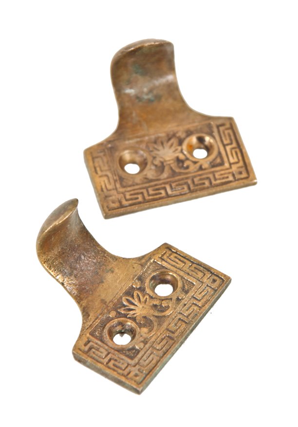 matching set of original c. 1870's ornamental cast bronze interior residential window sash pulls or finger lifts with neogrec key border