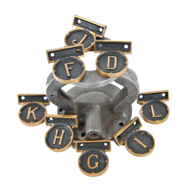 group of eight c. 1920 original ornamental cast bronze chicago bank building interior vault room letter plaques with black enameled inlay