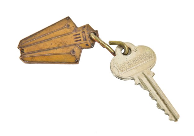 original c. 1920's american art deco style san francisco mark hopkins hotel guest room cast bronze building key fob and lockwood standard cut key