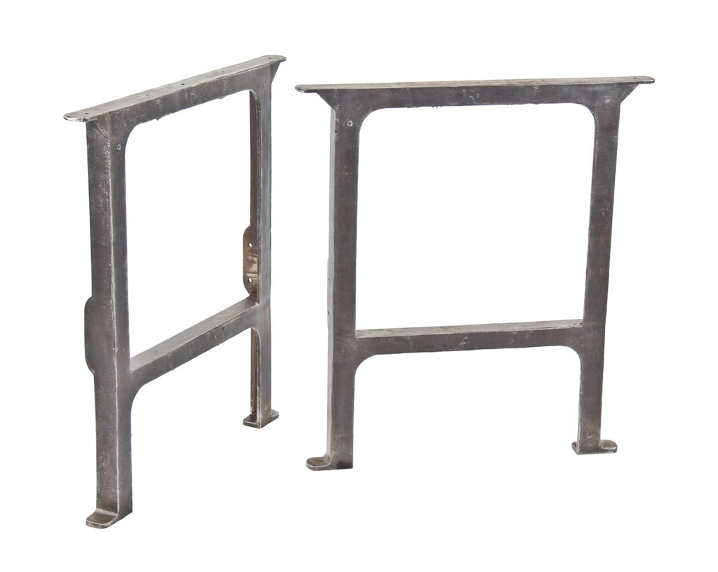 two matching c. 1900's structurally sound and robust refinished cast iron factory workbench bases or legs salvaged from a chicago paint factory
