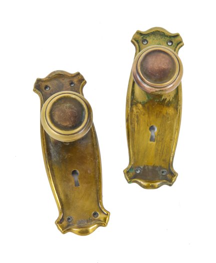nicely aged c. 1920's american craftsman style interior residential wrought yellow brass matching doorknobs and backplates