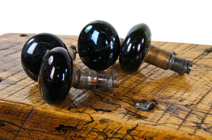 four original late 19th century antique american interior residential jet black porcelain passage door handles with patented shanks