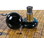 matching set of original 19th century antique american "screwless-spindle" jet black porcelain residential passage door handles