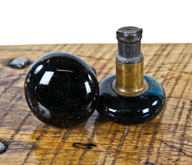 matching set of original 19th century antique american "screwless-spindle" jet black porcelain residential passage door handles