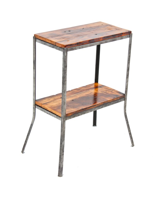 refinished antique c. 1930's american industrial stationary side table with an all-welded angled steel brushed metal frame supporting old growth pine wood shelves