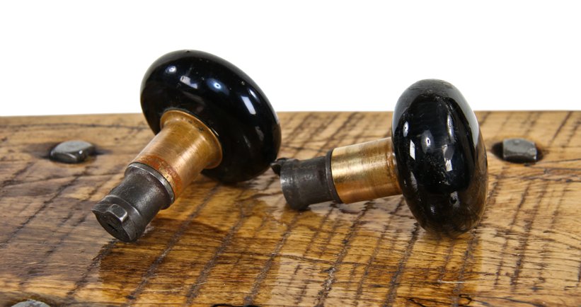 matching 19th century american antique jet black porcelain interior residential passage door "screwless spindle" doorknobs