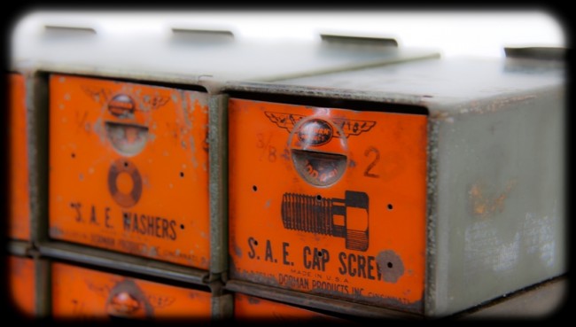 versatile c. 1940's american industrial interlocking diminutive pressed and folded steel compartments with intact lithographed graphics