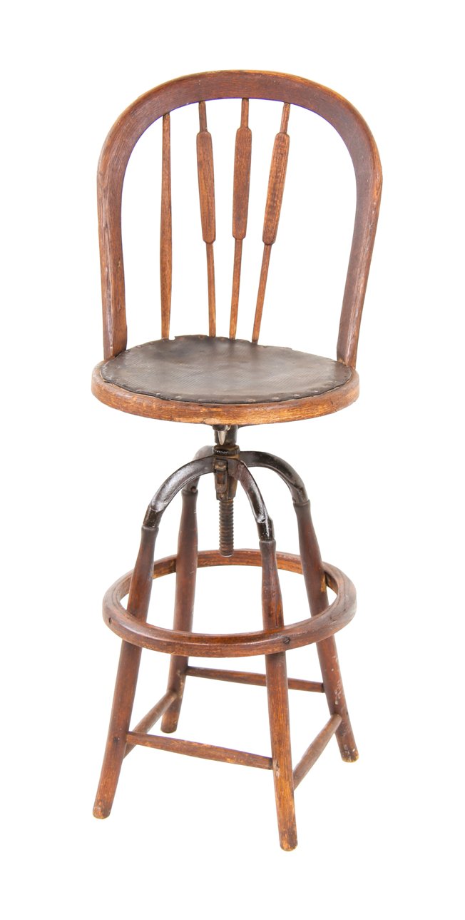 largely intact late 19th century timeworn varnished oak wood bow back revolving seat draftsman stool or chair with bent wood heel ring