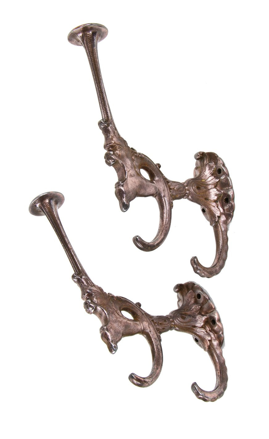two matching late 19th century american victorian era figural cast iron residential hall tree oversized hooks with copper-plated finish