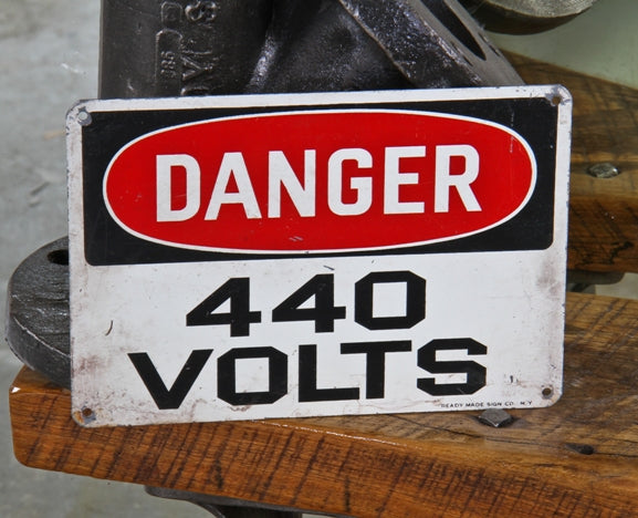 slightly worn late 1940's american vintage industrial "440 volts" die cut steel wall-mount factory danger sign