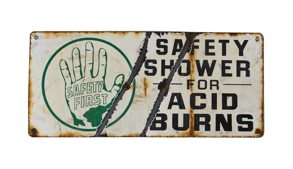 early example of an old industrial porcelain enameled "safety first" die cut steel notification sign salvaged from a general electric assembly plant