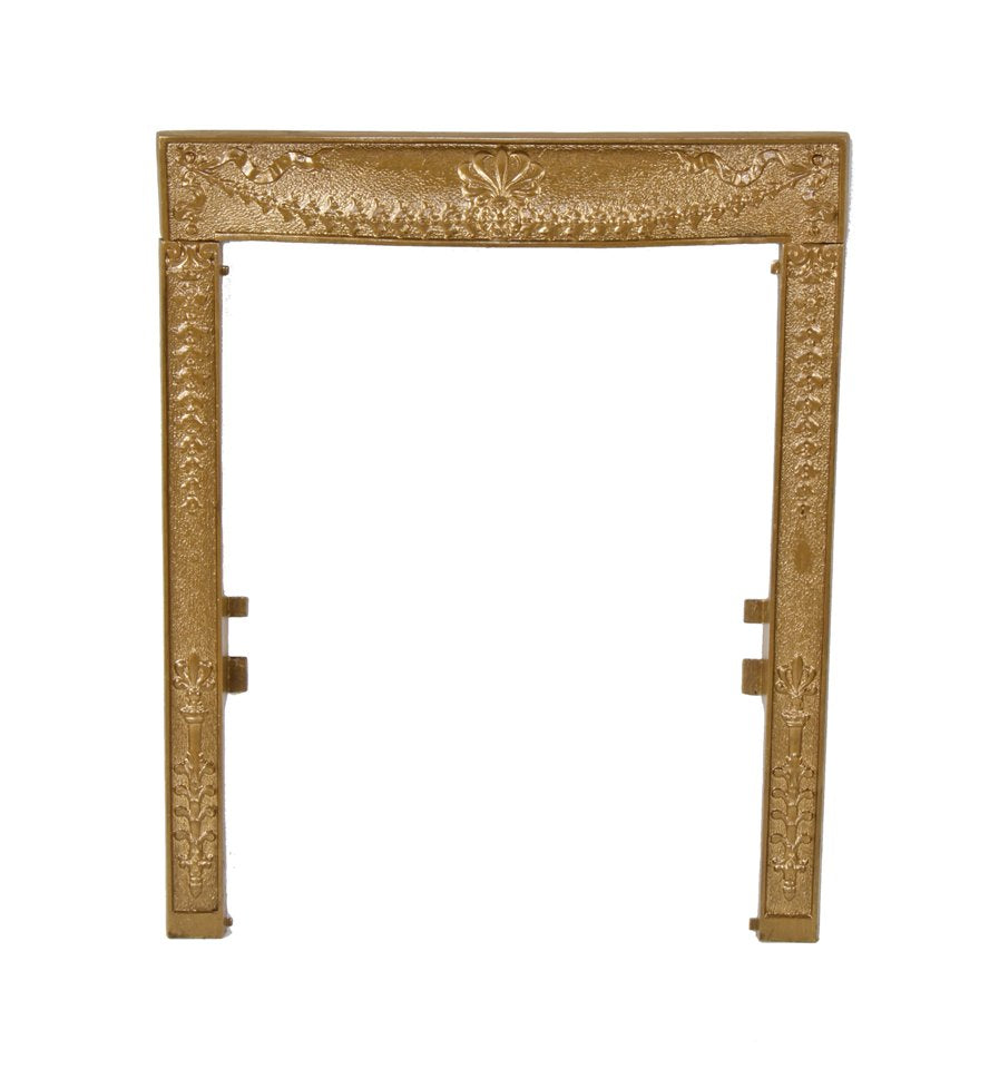 original late 19th century interior residential ornamental cast iron fireplace gas grate surround with centrally located anthemion and floriated swag motifs