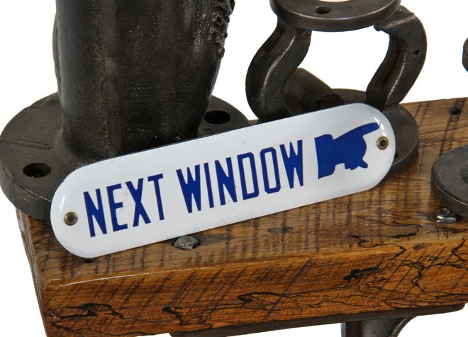 vintage american "new old stock" die cut steel porcelain enameled flush mount "next window" bank or office plaque with pointing finger