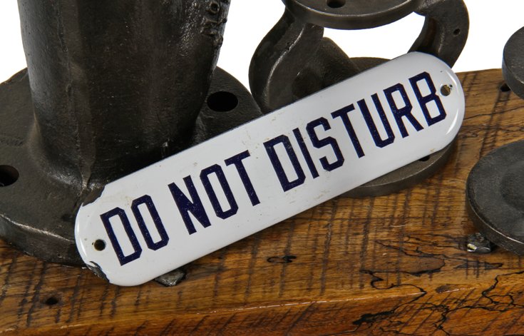 late 1920's american "new old stock" porcelain enameled die cut steel "do not disturb" flush mount warning or cautionary sign with intact grommets