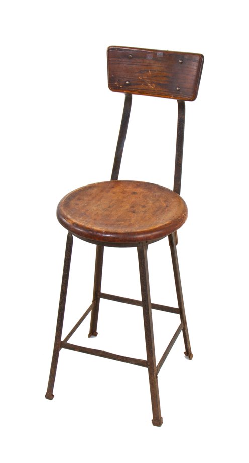 all original c. 1920's vintage industrial four-legged stationary factory stool with solid maple wood seat and slightly contoured oak backrest