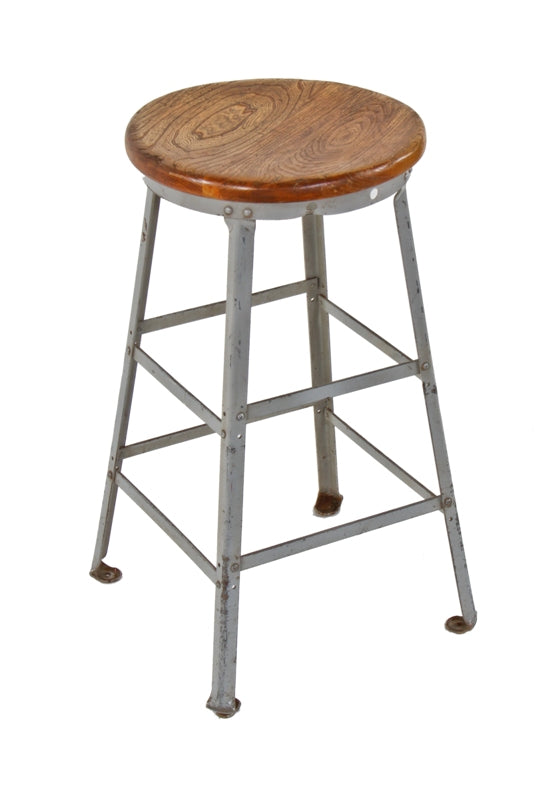 original late 1930's american industrial spring factory four-legged riveted joint gray enameled steel workbench stool with solid birch wood seat