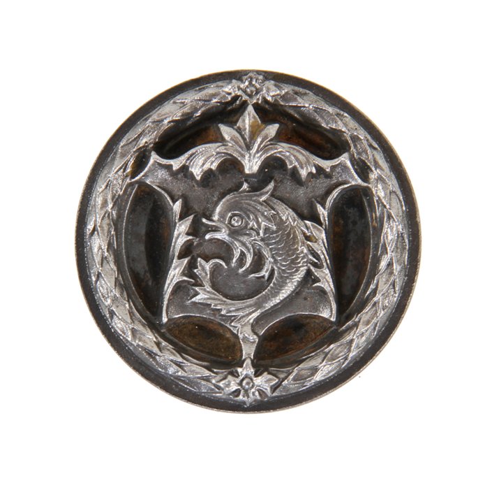 original late 19th century ornamental cast iron fisher building doorknob featuring a centrally located cartouche with detailed fish