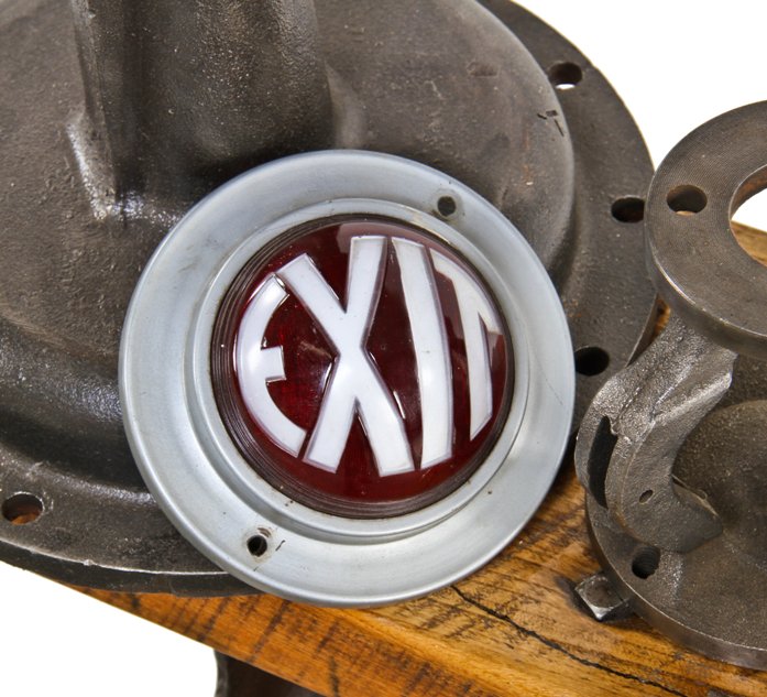late 1920's american art deco style machine age wall-mount interior illuminated theater exit light fixture with ruby red convex lens