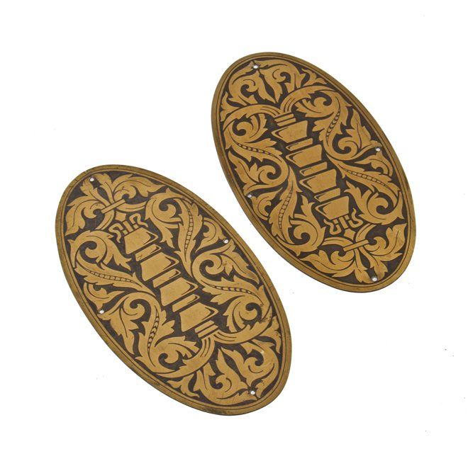 two matching lightly incised oval-shaped la salle hotel elevator door plaques designed by holabird and roche