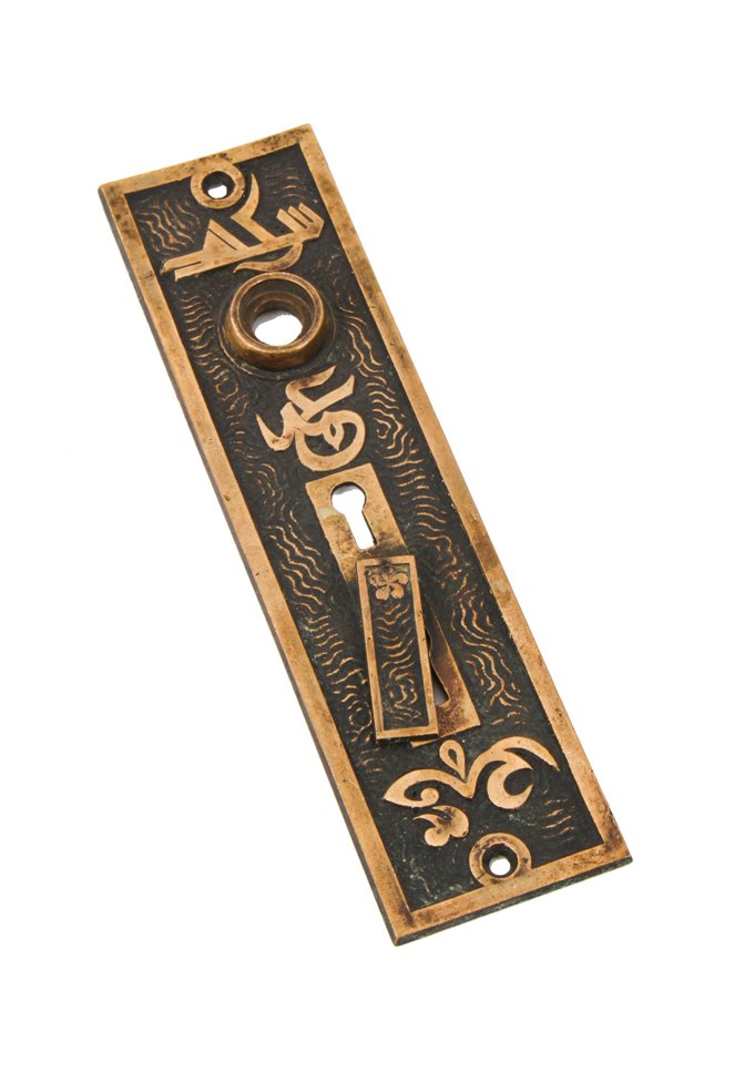 all original 19th century antique american exterior residential "arabic" pattern doorknob backplate with intact swinging keyhole cover