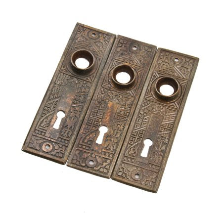 group of three matching late 19th century antique american eastlake style heavy gauge wrought steel passage door backplates