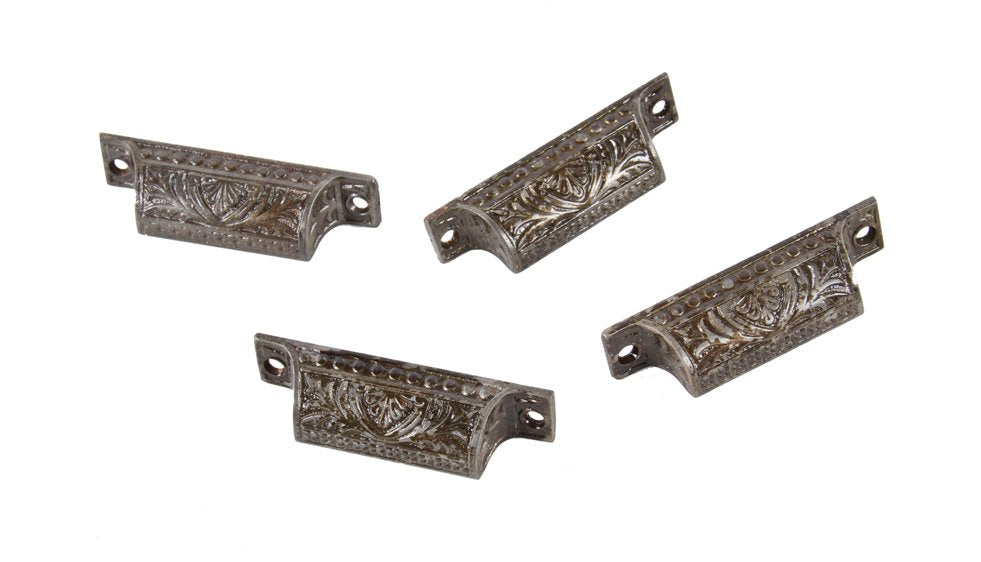 group of four matching 19th century antique american ornamental cast iron residential pantry cabinet drawer pulls with palmette motif