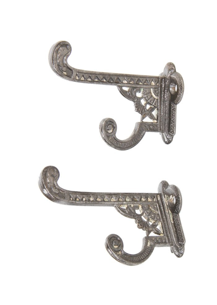 pair of original 19th century highly ornate refinished cast iron "oriental" pattern interior residential double coat hooks