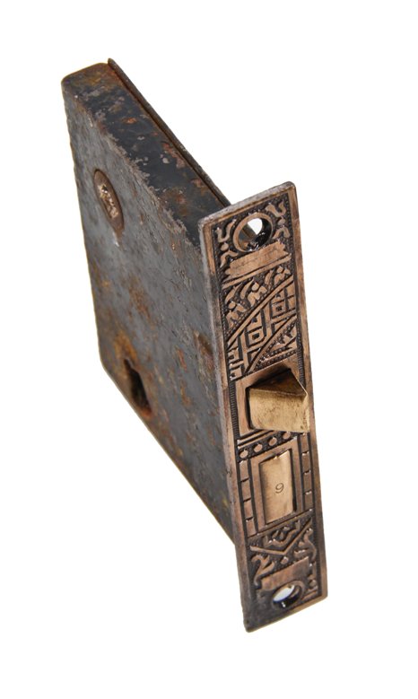 19th century original and fully functional interior residential "ceylon" pattern passage door mortise lock with brass-plated faceplate