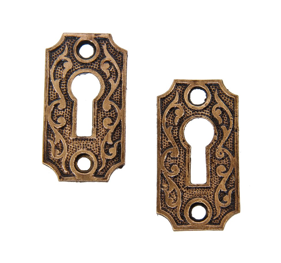 pair of all original 19th century american ornamental cast brass diminutive passage door keyhole escutcheons with foliated scollwork
