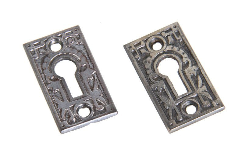 two matching refinished late 19th century ornamental cast iron interior residential passage door keyhole escutcheons with floral motifs