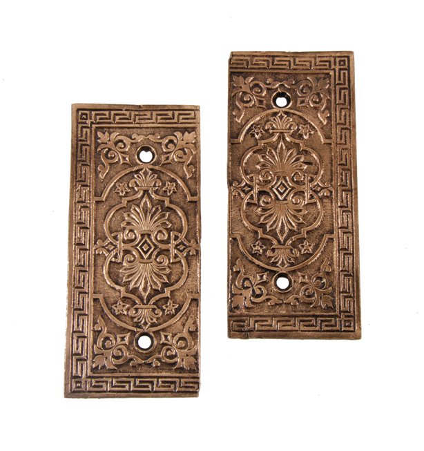 set of original 19th century american victorian era evenly patinated ornamental bronze metal door hinge plates with neogrec border