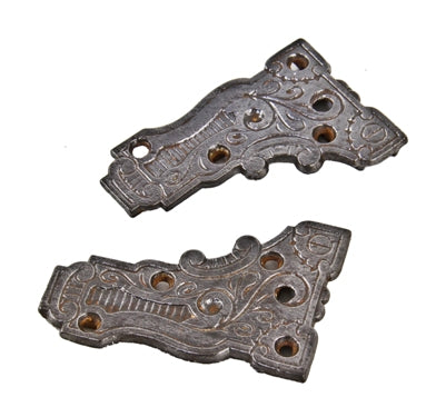 two matching original 19th century lightly incised ornamental cast iron exterior residential swinging porch door corner brackets