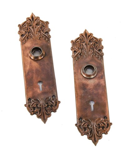 set of matching c. 1906 antique american ornamental cast iron richardsonian romanesque style "panama" pattern interior residential backplates