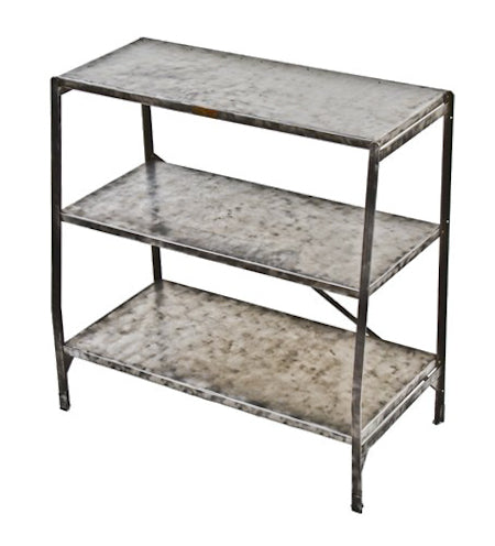 refinished american antique industrial multi-tier stationary four-legged angled steel store display shelving unit with a brushed metal finish