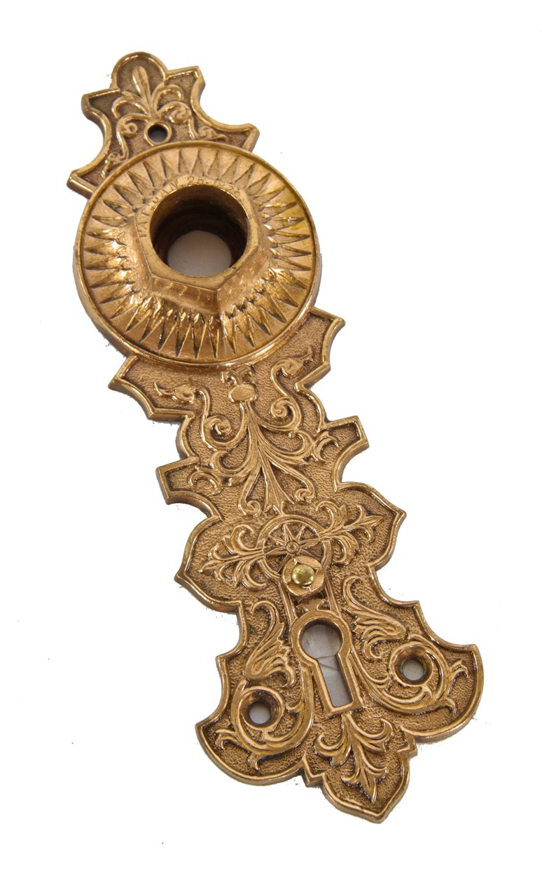 original c. 1870's ornamental cast bronze interior residential "compression cast" passage door backplate with incised patent date around the thimble