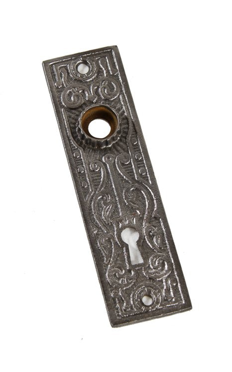 late 19th century antique american interior residential flush mount ornamental cast iron doorknob backplate or escutcheon with fluted thimble