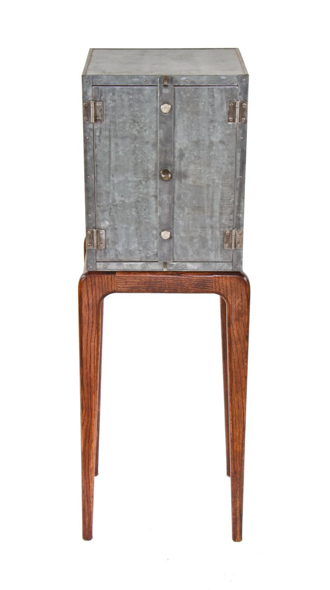 uniquely designed repurposed american industrial riveted joint steel cabinet with a newly added "danish modern" style four-legged tapered and turned base